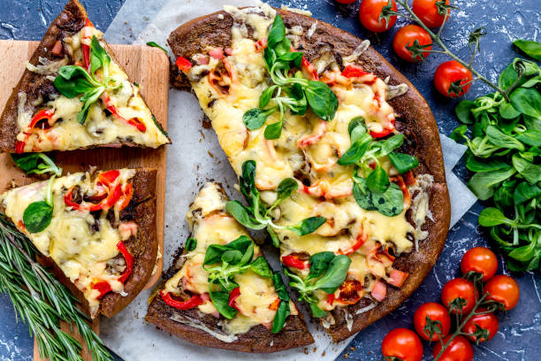 istock cooking pizza with vegetables and cheese on stone desk background top view 685247284
