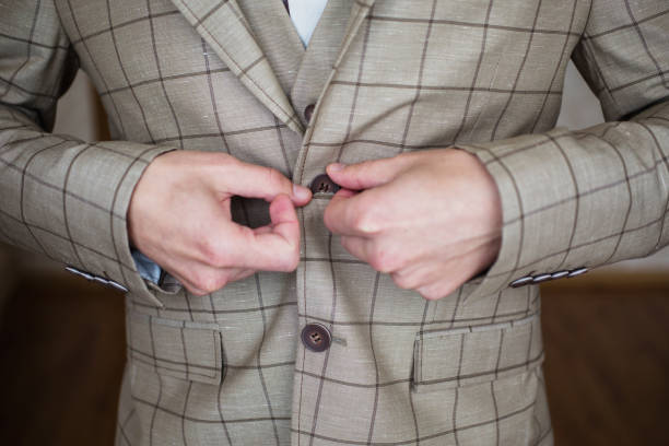 istock Man buttoning his jacket. Men's style. Professions. Preparing to work on meeting. 685260244