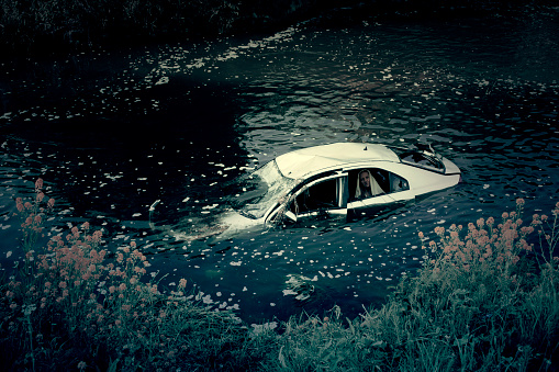 Photo Of A Car Crash In River With Ghost