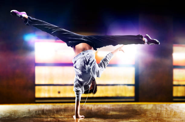 Young woman dancer Young woman dancer on urban background. handspring stock pictures, royalty-free photos & images