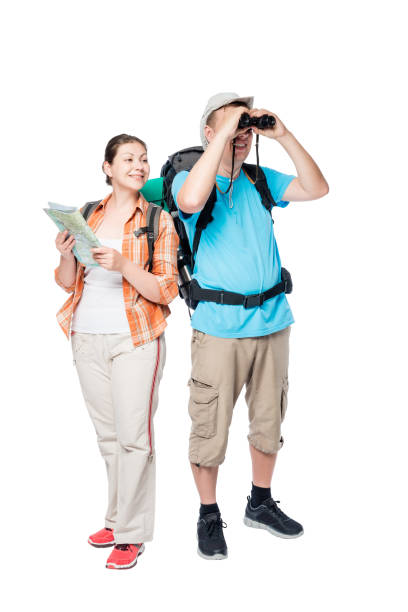 istock man looking through binoculars woman holding a map isolated active travelers 685276908