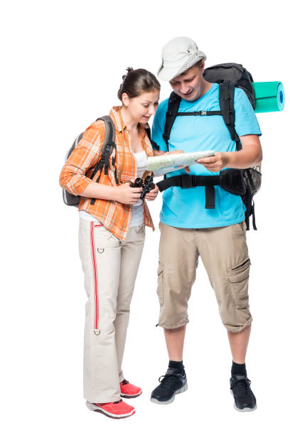 istock couple travelers with backpacks and map on a white background 685276914
