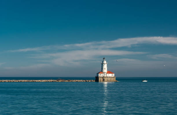 istock White lighthouse on Michigan Lake 685298632