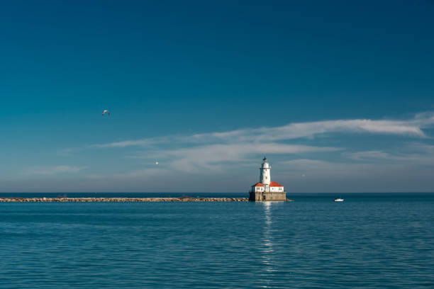 istock White lighthouse on Michigan Lake 685298638