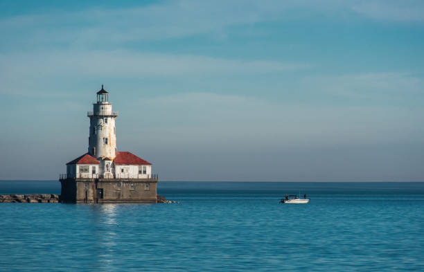 istock White lighthouse on Michigan Lake 685298640
