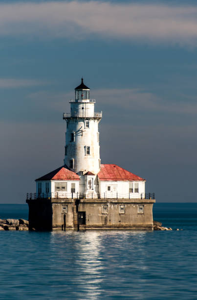 istock White lighthouse on Michigan Lake 685298642