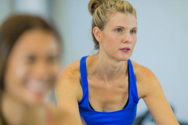 istock Women Training on a Bicycle in the Gym 685298688