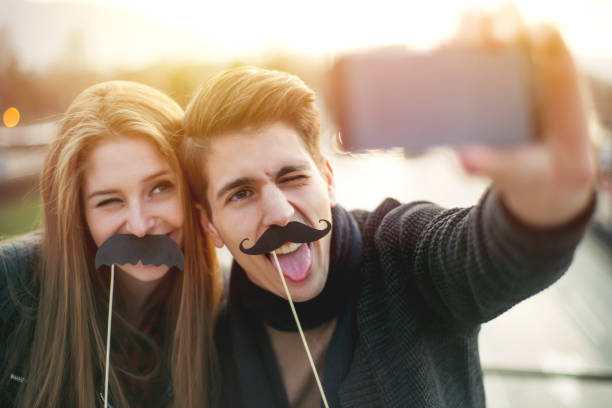 Selfie with fake mustaches stock photo