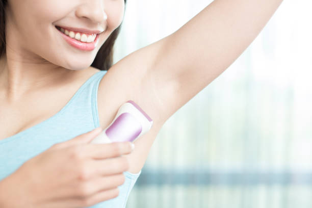 istock woman with armpit plucking 685389198