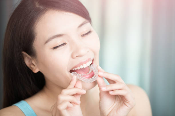 istock woman with invisible braces 685391690