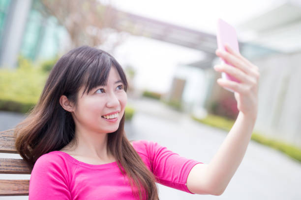 istock woman smile ans selfie 685397058