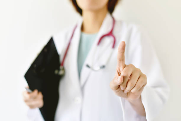 istock Female doctor hand forefinger pointing on empty space, Doctor hand touching virtual screen. 685414402