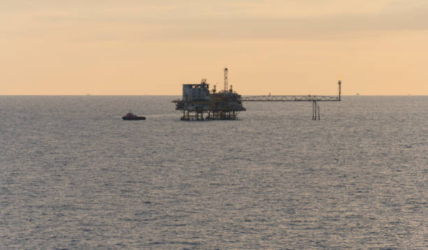 istock oil production platform and vessel 685414710
