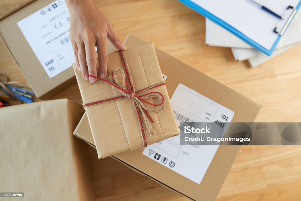 Sending gifts Gift box and parcels on table., view from above Gift Stock Photo