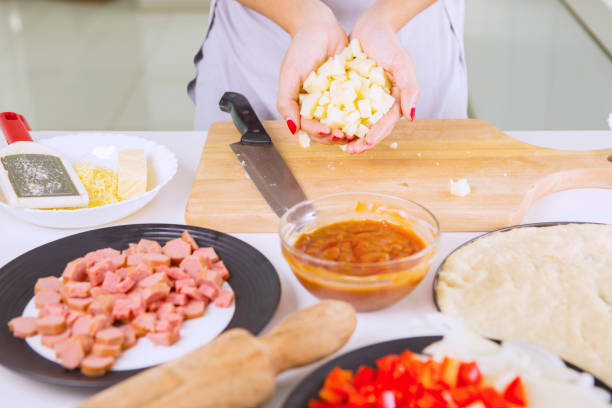istock Woman's hand holds slices of cheese 685420318