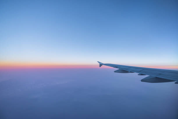 istock Airplane wing in the sky with morning light 685420370