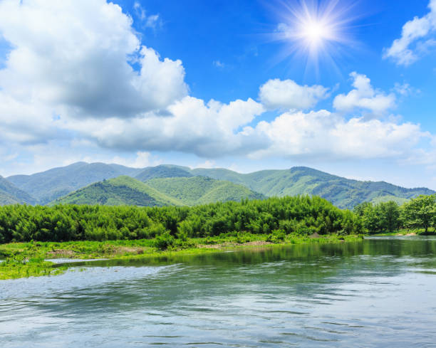 istock River and green mountains under the blue sky 685420642