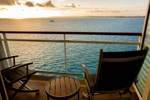 empty deck chair on a cruise ship balcony at dusk - balcony imagens e fotografias de stock