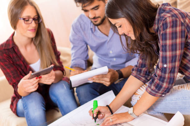 istock Three young students working together on a new project. Start up concept. 685427518