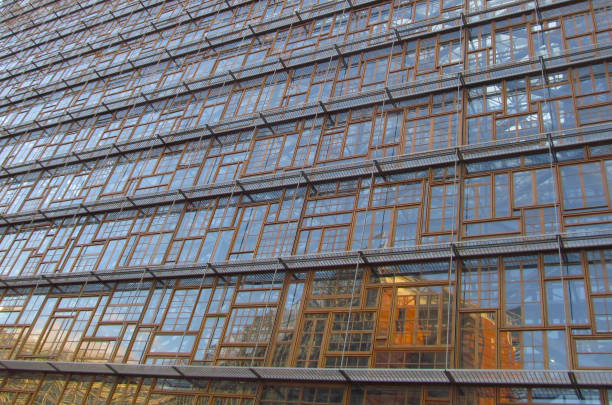 A glass ofccie building facade on a clear sky day