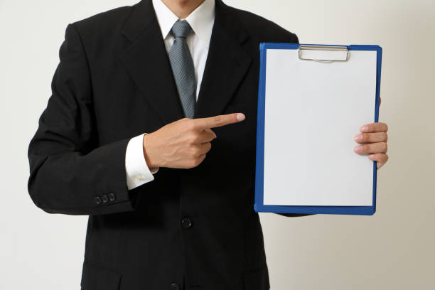 istock business person holds a clipboard 685438494
