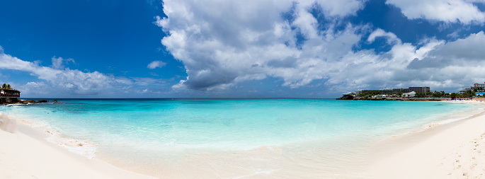 Pretty calm bay on a partly cloudy day with blue waters in St. Maarten Caribbean