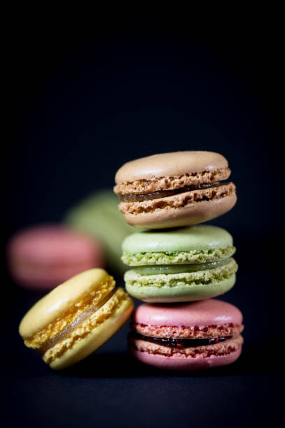 istock Cake macaron or macaroon isolated on black background, sweet 685452190