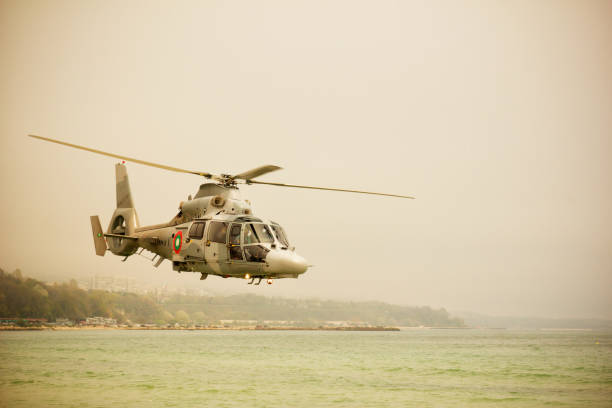 istock Military navy helicopter flying over sea 685452660