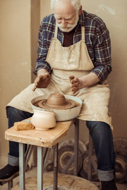 istock Front view of male craftsman working on potters wheel 685455376