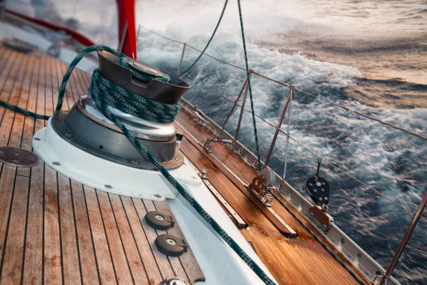 sail boat under the storm, detail on the winch stock photo