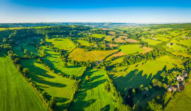 istock Summer fields green patchwork pasture idyllic country farms aerial panorama 685461774