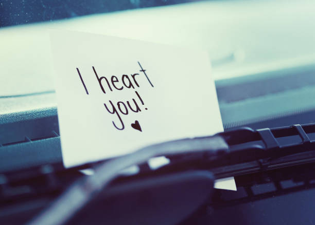 istock Handwritten note on windscreen wiper reads 