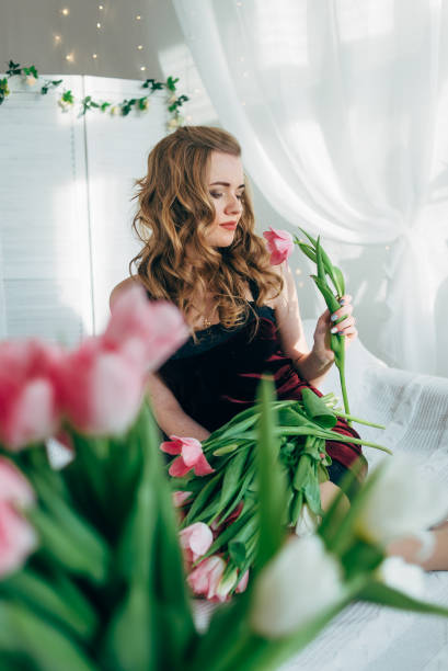 istock Girl with tulips 685470936
