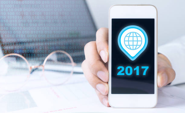 istock Business man holding a phone with 2017 connection 685478510