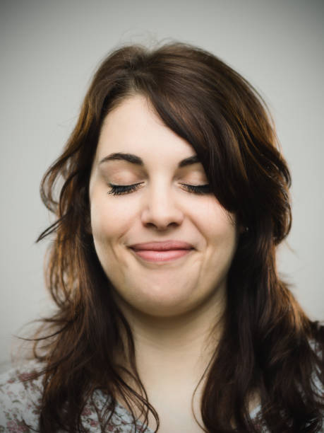 istock Beautiful young woman smiling with closed eyes 685479174