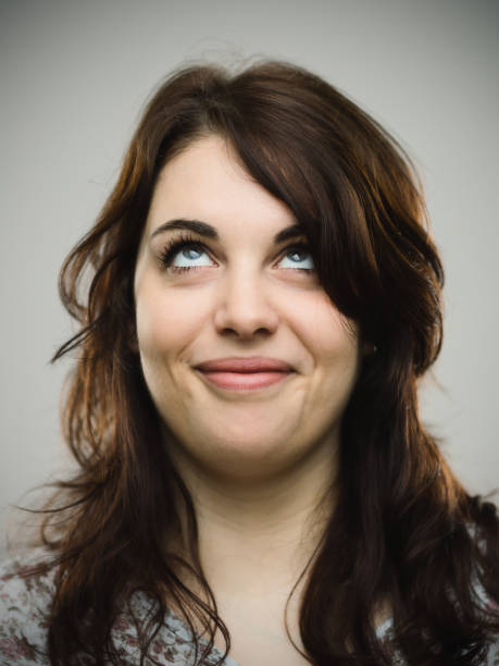 istock Real young woman looking up and smiling 685479242