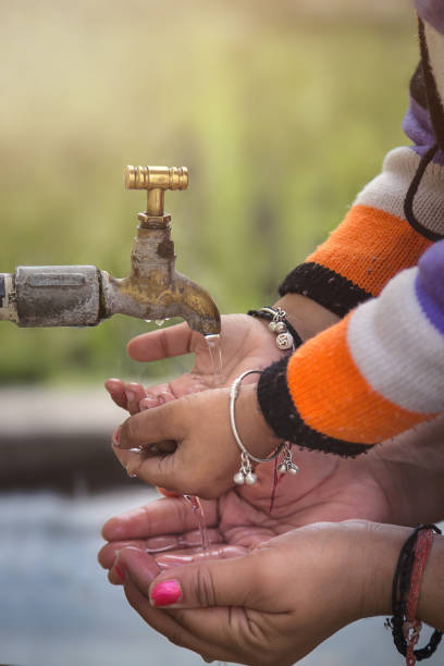 Mother and Child Hands Under Tap water