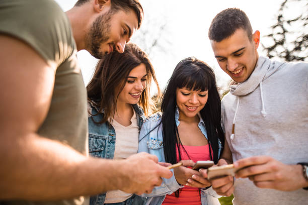 istock group of friends doing social networking 685487714