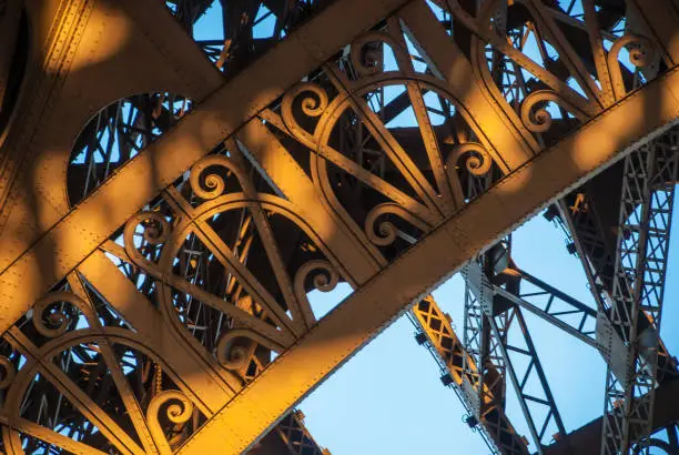 Photo of Arch structure Eiffel Tower Tour Eiffel blue sky steel structure in evening sunset sun