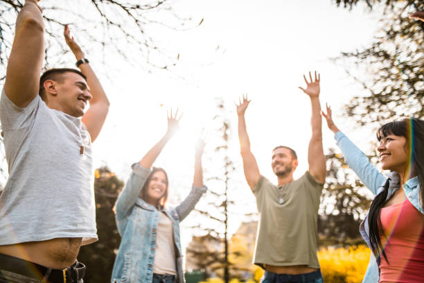 istock group of friends teamwork in the park 685488960