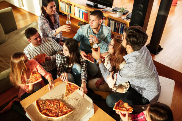 istock Group of young friends eating pizza 685489518