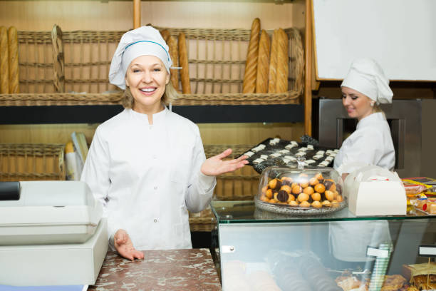 istock female cooks with fresh and tasty bread in bakery 685498666