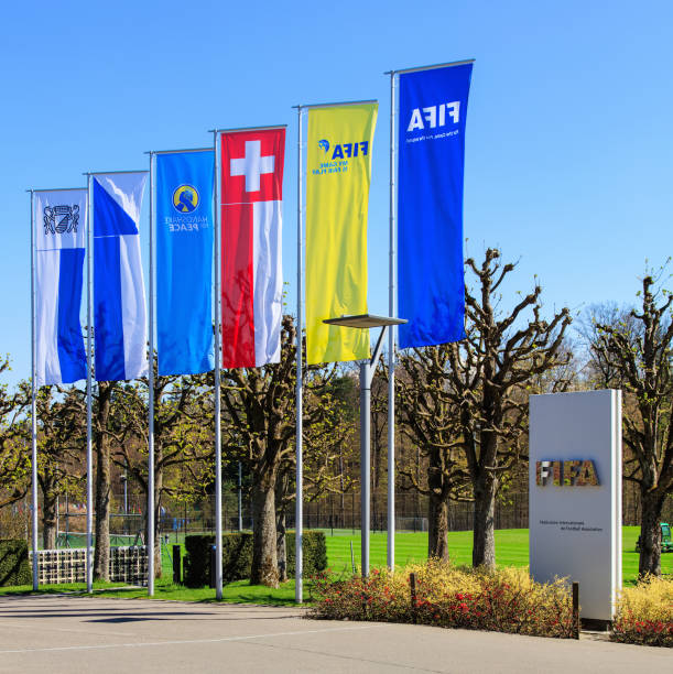 Flags and a stele at the entrance to the FIFA headquarters in Zurich, Switzerland stock photo