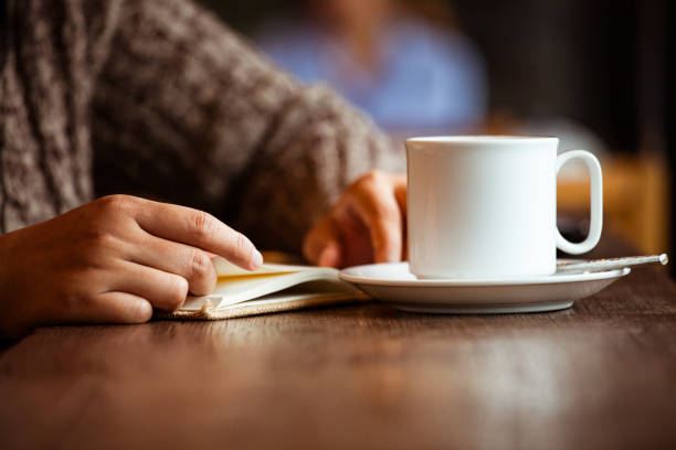 istock Closeup on woman hand holding a book while she is reading a book 685503114