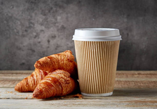 istock paper coffee cup and croissants 685512164