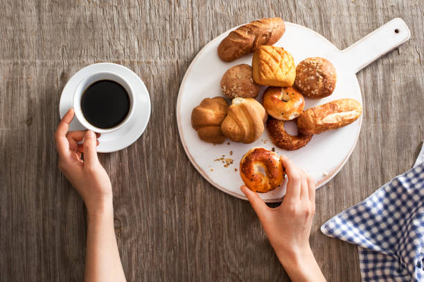 istock Hot coffee and pastries on a wooden background 685523098