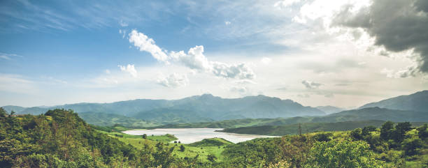 istock meadow, lake and blue sky 685523522