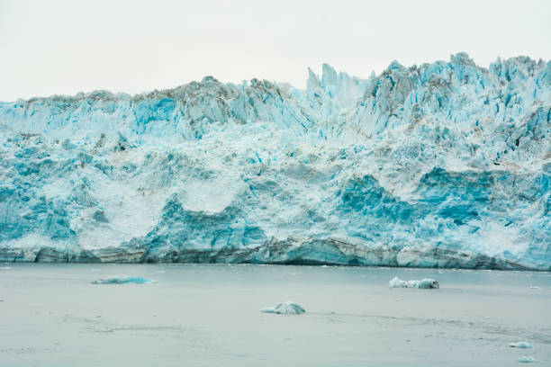 Massive Hubbard Glacier reaching water stock photo