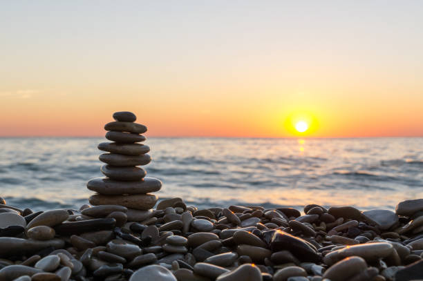 istock Cairn stones on the beach on sundown 685526782
