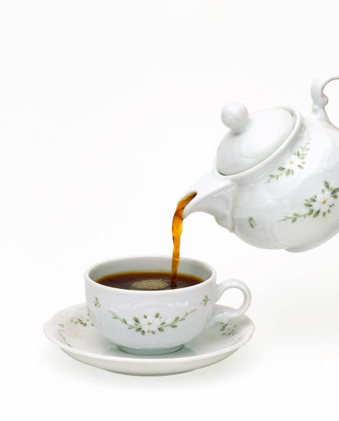 istock Porcelain teapot pouring tea 685549696
